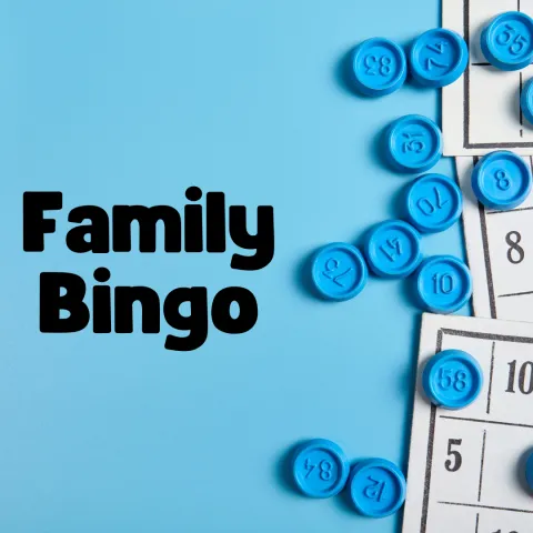 This image contains a scattering of bingo cards and blue chips on a light blue background. Black text reads "Family Bingo"