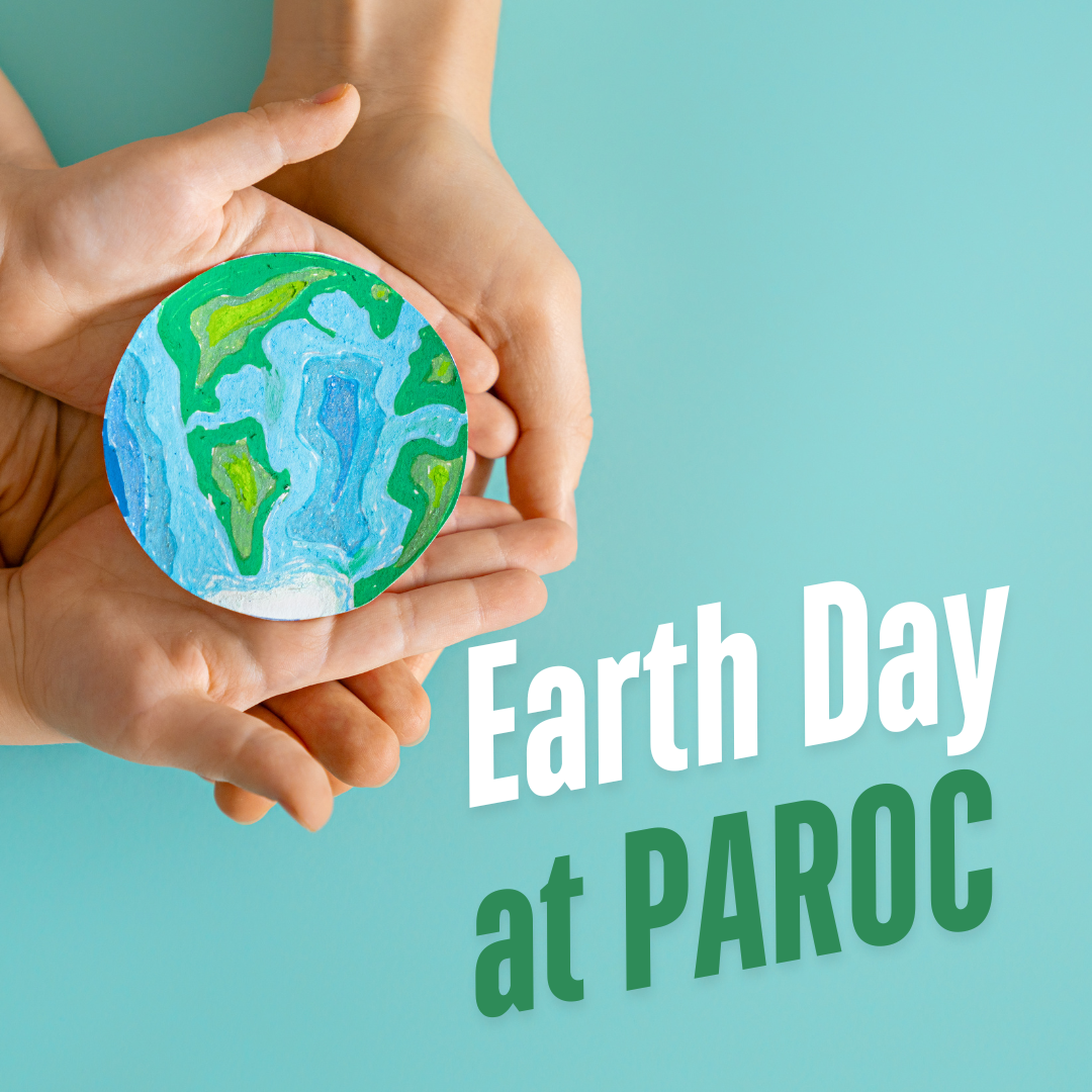 multiple hands holding paper earth on blue background, text reads "earth day at PAROC"