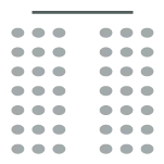 Two rows of chairs with a center aisle facing a stage at the front of the room.